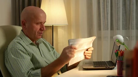 Businessman with Newspaper in Office Room Reading Daily News Stock Footage
