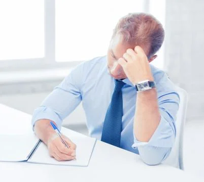 Businessman with notebook and computer Stock Photos