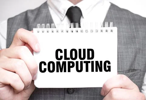 Businessman with notebook with text CLOUD COMPUTING Stock Photos