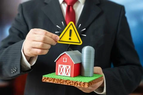 A businessman notes problems with the farming enterprise. Disease outbreaks.. Stock-Fotos