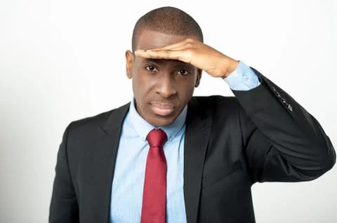 Businessman observing something closely Stock Photos