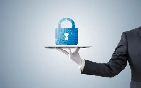 Businessman offering computer security on silver tray Stock Photos