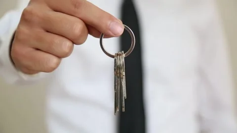 Businessman Offering Key Toward Camera Stock Footage 344913269