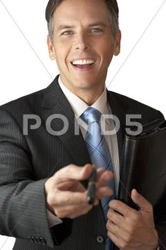 Businessman Offers Pen with Big Smile and Closed Binder Stock Photos