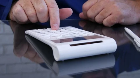 Businessman in Office Calculating Using Adding Machine Stock Footage 95951999