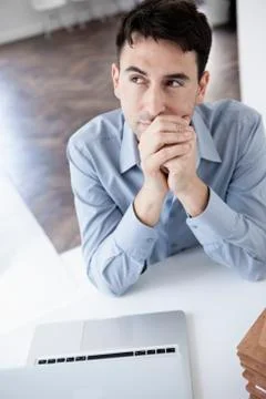 Businessman in office, musing, portrait Stock Photos
