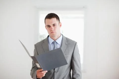 Businessman with open folder Stock Photos