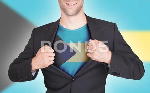 Businessman opening suit to reveal shirt with flag Stock Photos