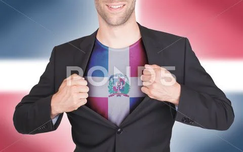 Businessman opening suit to reveal shirt with flag Stock Photos