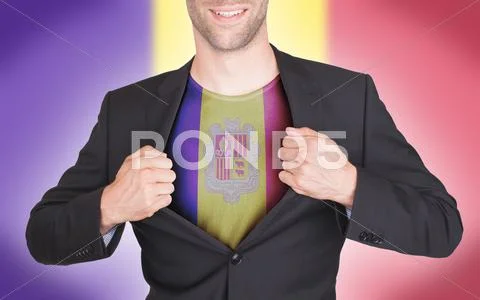 Businessman opening suit to reveal shirt with flag Stock Photos