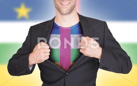 Businessman opening suit to reveal shirt with flag Stock Photos