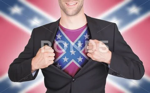 Businessman opening suit to reveal shirt with flag Stock Photos