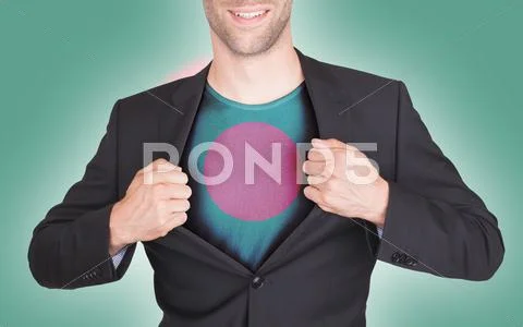 Businessman opening suit to reveal shirt with flag Stock Photos