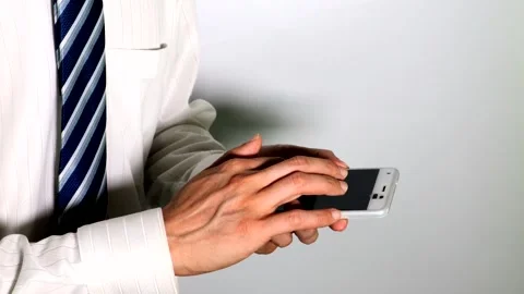 Businessman operating a smartphone Stock Footage 334679835