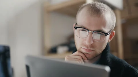 Businessman or estate agent checking a property portfolio online Stock Footage 62025877