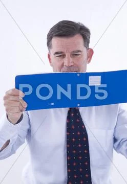 Businessman, over 50, with bank receipts Stock Photos