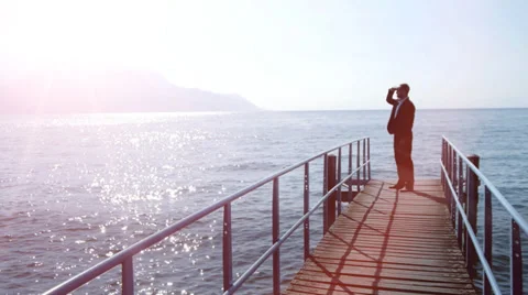 Businessman overlooking lake. progress upwards. success. path road. person man Stock Footage 37991671