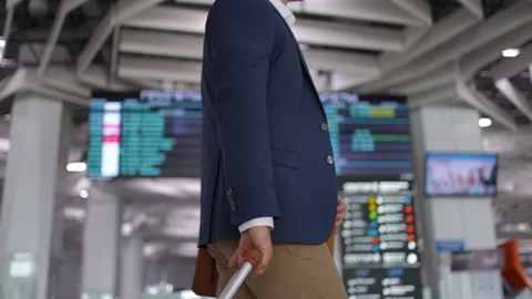 Businessman passenger pulling suitcase, handbag luggage in modern airport Stock Footage 166252597