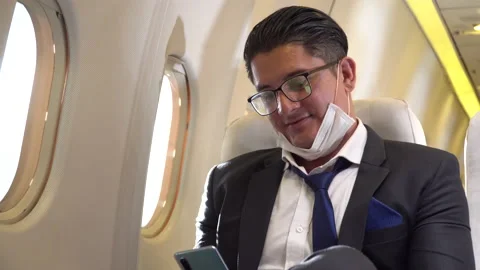 Businessman passengers incorrect wearing protective medical face mask on chin Stock Footage 147240360