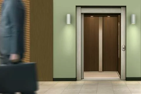 Businessman passing open elevator Foto stock