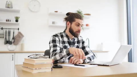 Businessman with pen making notes on draft of paper document. Stockbeeldmateriaal 268865444