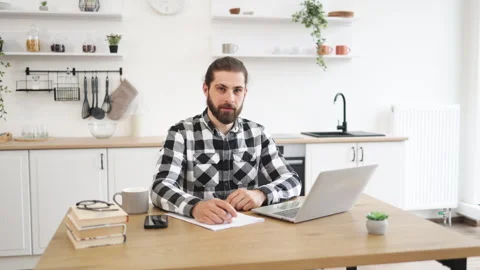 Businessman with pen making notes on draft of paper document. Stockbeeldmateriaal 268880697