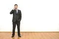 The businessman phones on the white wall background Photo