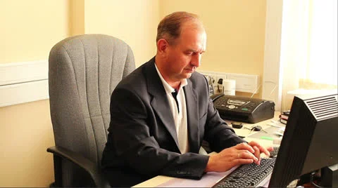 Businessman pick up the phone in front of the computer table. Stock Footage 24857545