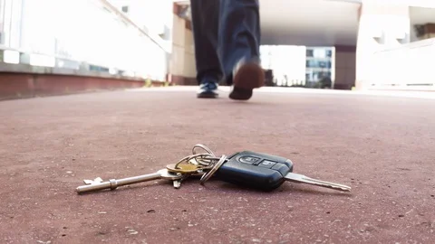 Businessman picking up lost keys Video stock 104069914