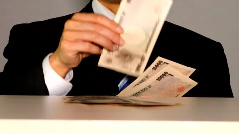 A businessman places banknotes on the table. Stock Footage 335029290