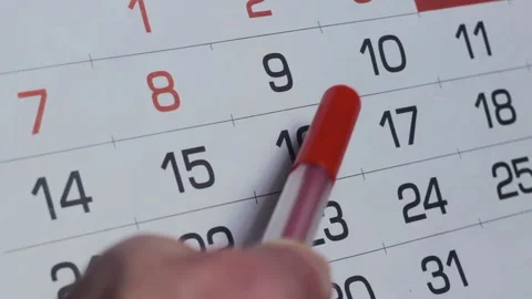 Businessman Planning Schedule Indicates important Dates On Calendar By Red Pen Video stock 129710145
