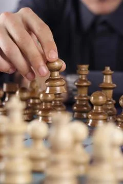 Businessman playing chess Stock Photos