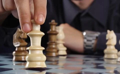 Businessman playing chess Stock Photos