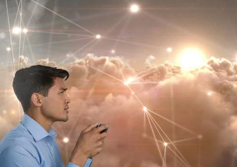 Businessman playing with computer game controller with line light connections in Stock Photos