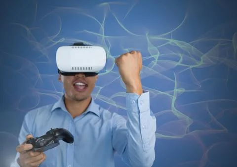 Businessman playing with computer game controller with virtual reality headset Stock Photos