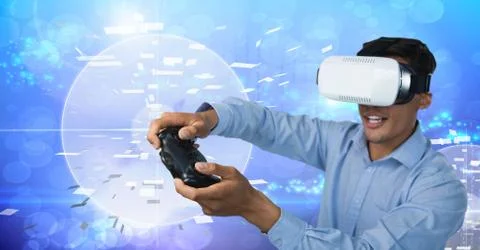 Businessman playing with computer game controller with virtual reality headset Stock Photos