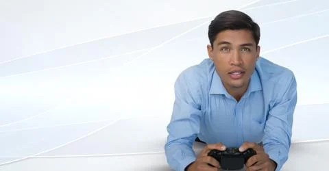 Businessman playing with computer game controller with bright background Stock Photos