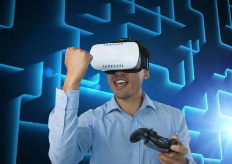 Businessman playing with computer game controller with blue maze background Stock Photos