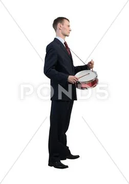 Businessman playing drums Stock Photos