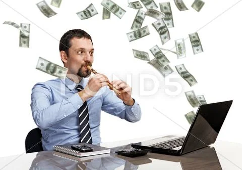 Businessman playing on flute in front of laptop, from which flying money Stock-Fotos