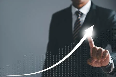 Businessman pointing arrow graph growth and financial network connection Stock Photos