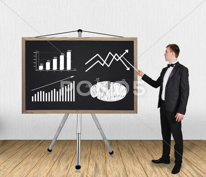 Businessman pointing on chart Stock Photos