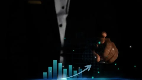 Businessman pointing at digital graph with glowing elements Stock Footage 327856886