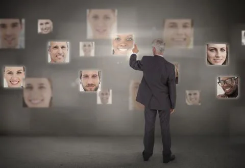 Businessman pointing at digital interface Stock Photos