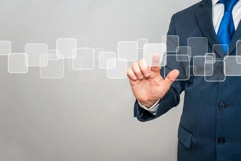 Businessman pointing at a digital interface Stock Photos