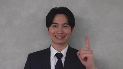 Businessman Pointing One Finger Forward with Confident Expression Stock-Footage 344085736
