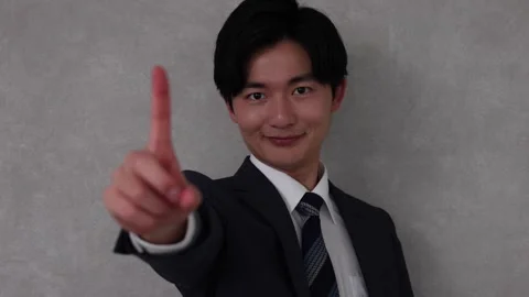 Businessman Pointing One Finger Forward with Confident Expression Stock-Footage 344085837