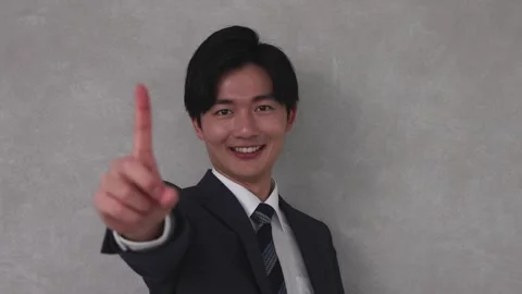 Businessman Pointing One Finger Forward with Confident Expression Stock-Footage 344085843