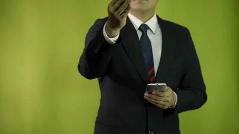 Businessman pointing with one hand at something in front, touching the screen Video stock 275348243