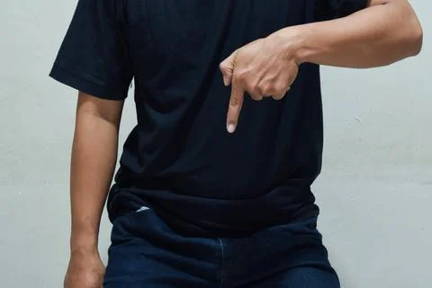 Businessman is pointing at a subscription button down below Stock Photos